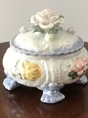 Vintage iridescent porcelain footed trinket box with applied floral decorations
